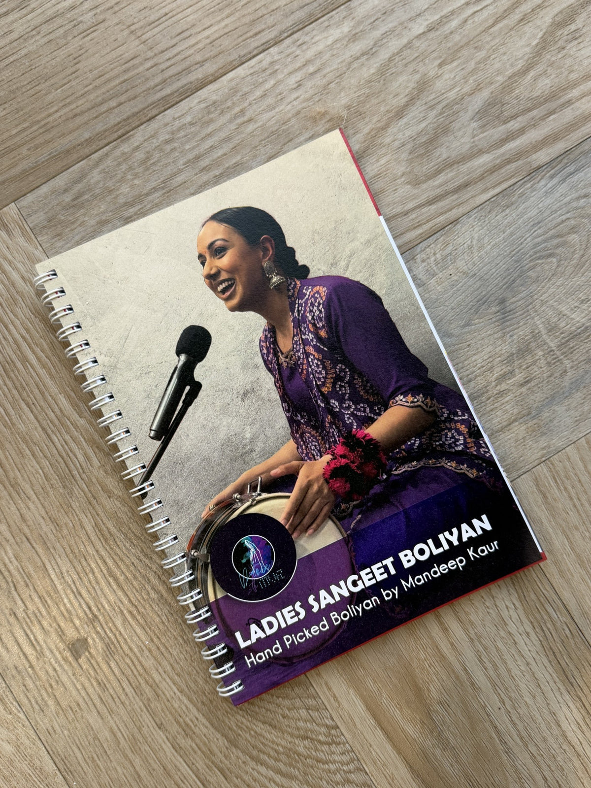 Ladies Sangeet Boliyan book by Mandeep Kaur, founder of Dance With MVR, featuring traditional Punjabi wedding boliyan.