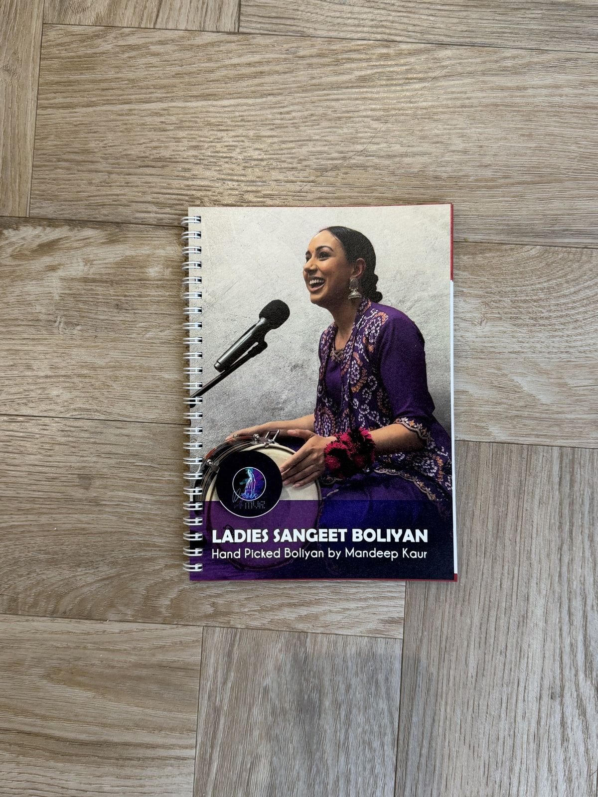 Ladies Sangeet Boliyan book by Mandeep Kaur, founder of Dance With MVR, featuring traditional Punjabi wedding boliyan.