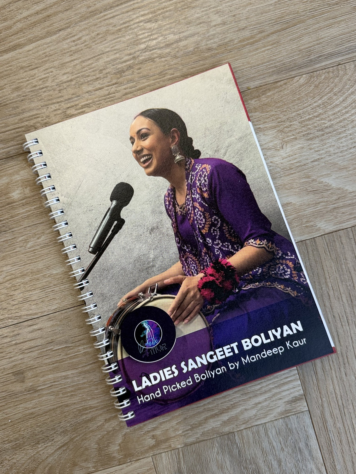 Ladies Sangeet Boliyan book by Mandeep Kaur, founder of Dance With MVR, featuring traditional Punjabi wedding boliyan.