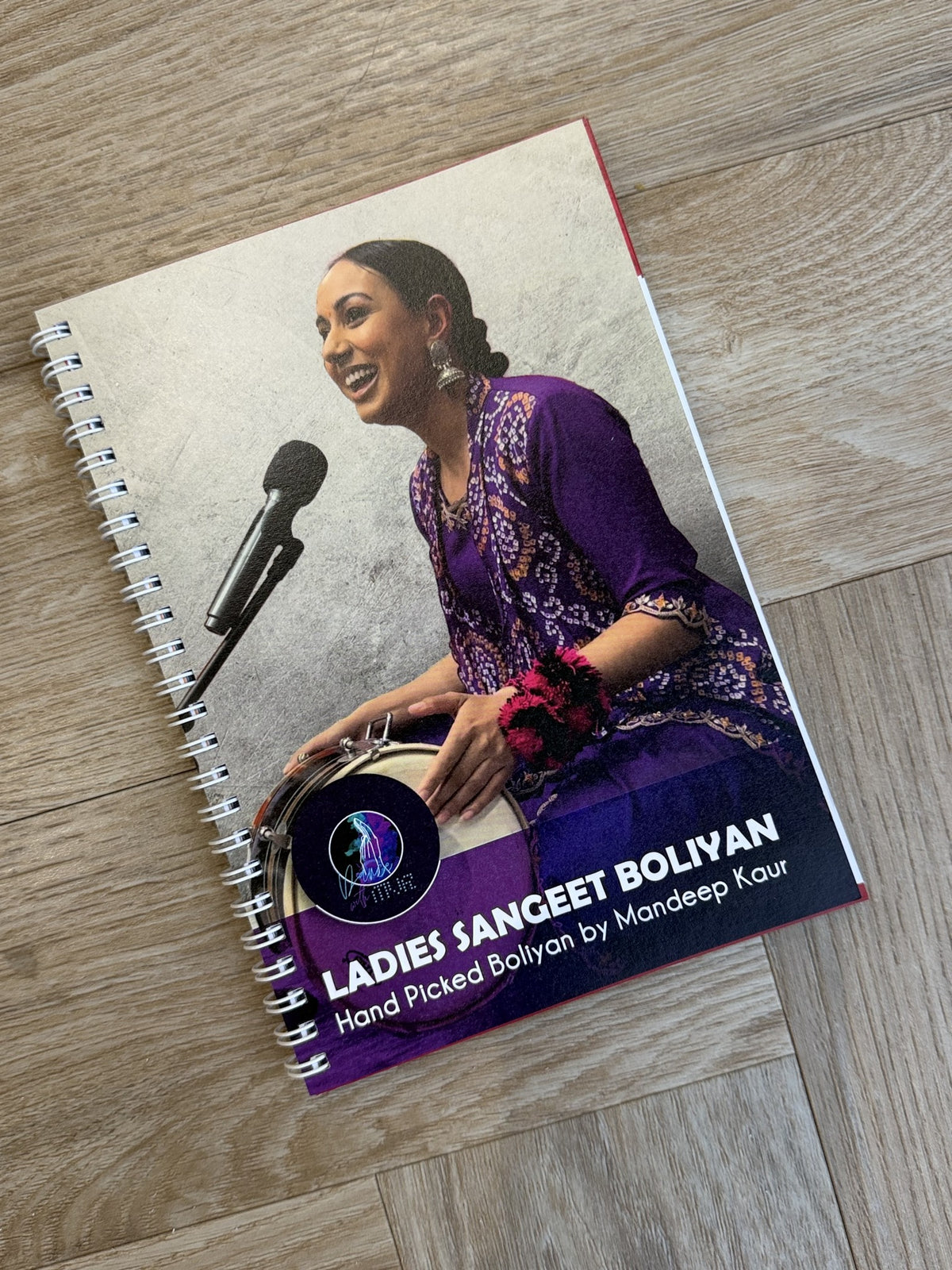 Ladies Sangeet Boliyan book by Mandeep Kaur, founder of Dance With MVR, featuring traditional Punjabi wedding boliyan.
