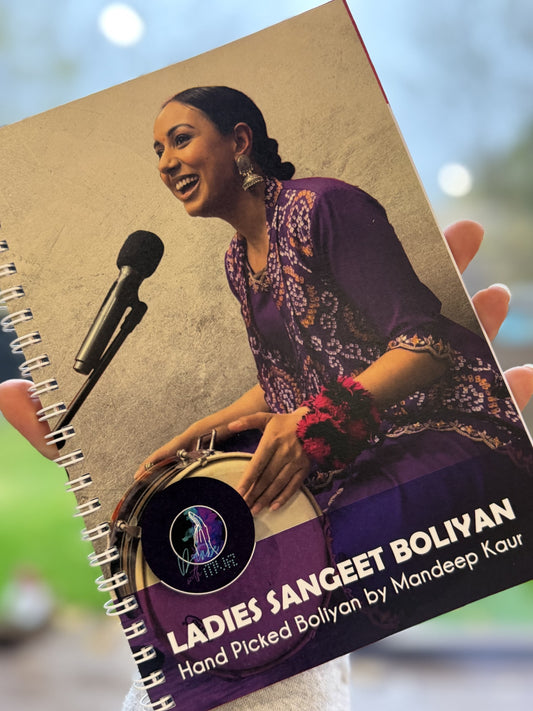 Ladies Sangeet Boliyan book by Mandeep Kaur displayed in hand, featuring Punjabi songs for wedding celebrations.