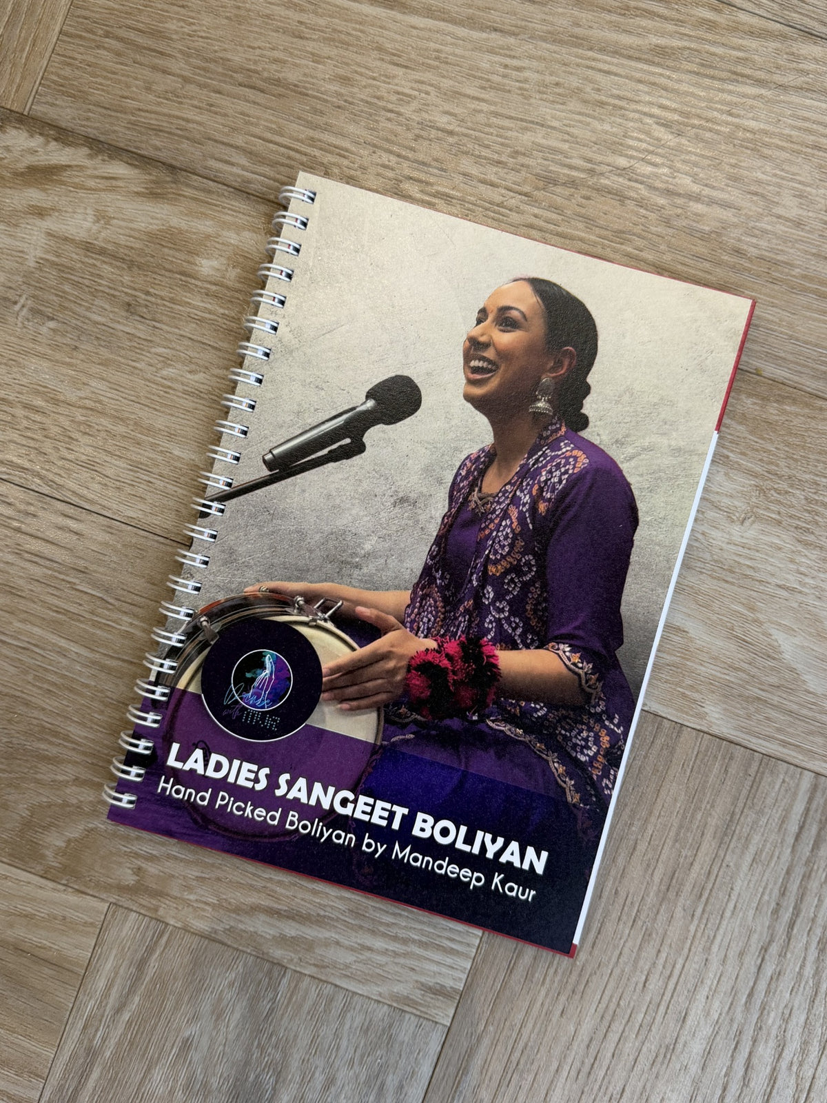 Ladies Sangeet Boliyan book by Mandeep Kaur, founder of Dance With MVR, featuring traditional Punjabi wedding boliyan.